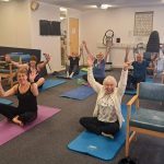Members seated in group exercise class