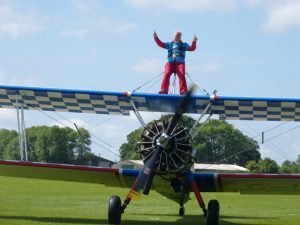 Supporter on plane on ground doing wing walk challenge