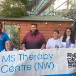 Supporters with banner for marathon runners